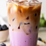 Delicious Blueberry Latte with homemade blueberry syrup and espresso served with milk.