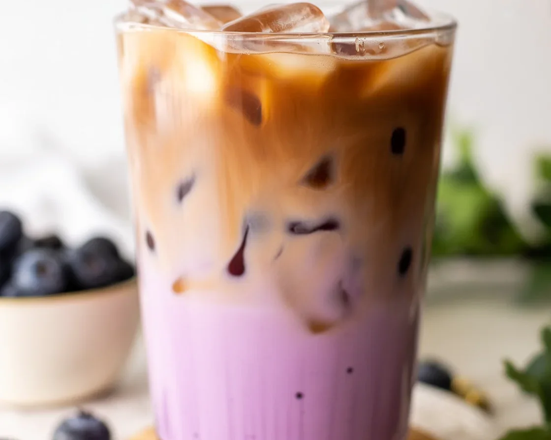 Delicious Blueberry Latte with homemade blueberry syrup and espresso served with milk.