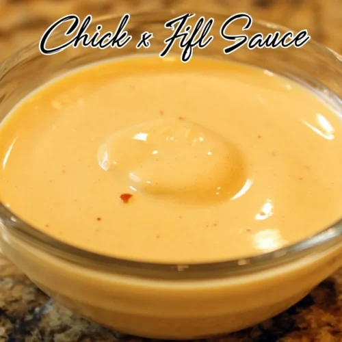 Homemade Chick Fil A dipping sauce in a bowl with ingredients around it