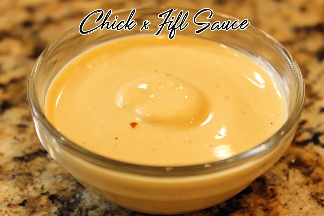Homemade Chick Fil A dipping sauce in a bowl with ingredients around it