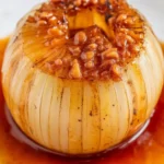 Delicious Onion Boil recipe featuring butter, spices, and a sweet onion baked to perfection.