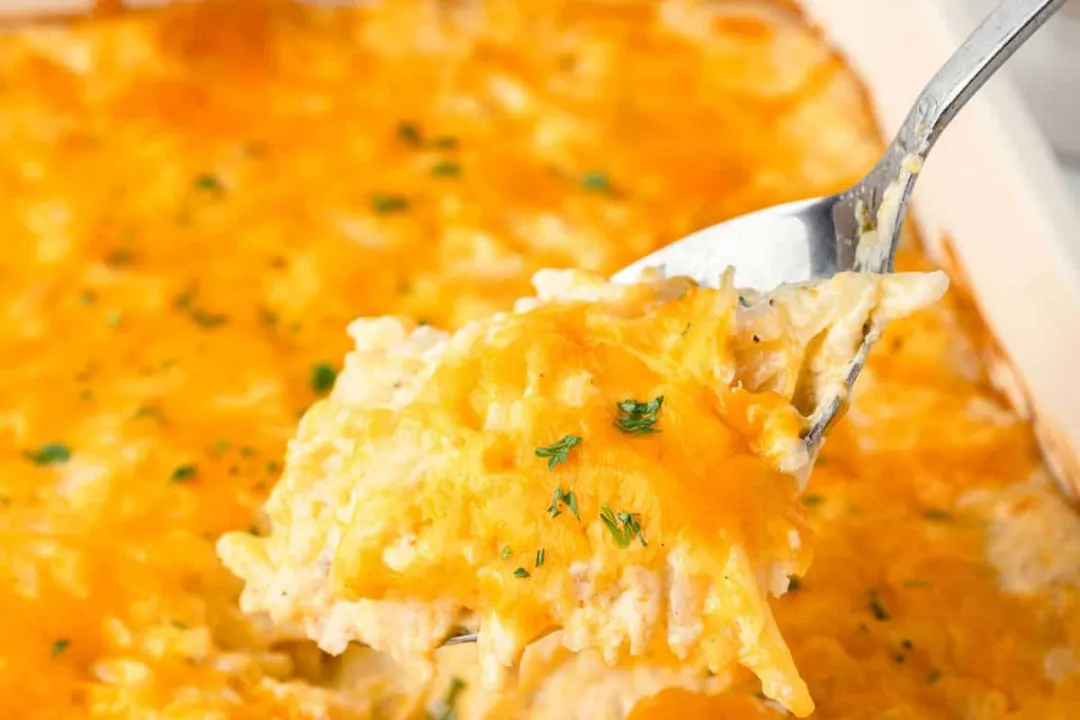 Delicious Cracker Barrel Hashbrown Casserole with cheese, onions, and crispy top