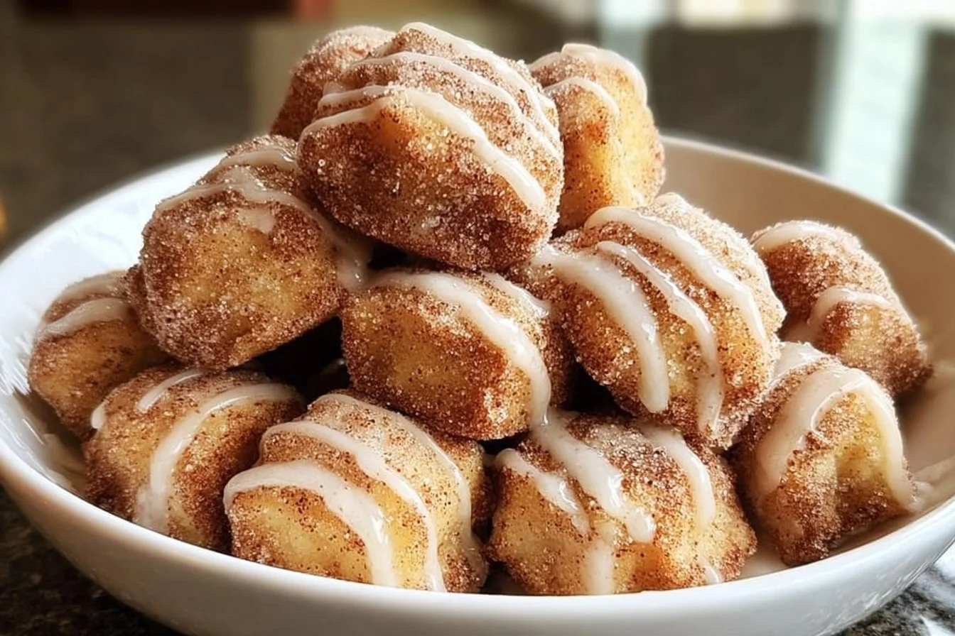 Freshly baked cinnamon sugar biscuit bites on a plate