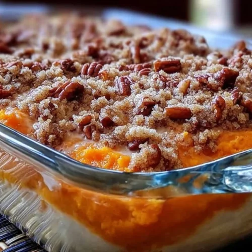 Delicious Southern sweet potato casserole topped with marshmallows and pecans.